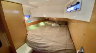 Queen bed in stern cabin  on  Sailing Yacht Curlew Escape, available for private yacht charters on Moreton Bay, Brisbane.