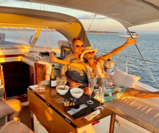 Couple on a sunset sail on a private yacht charter on Curlew Escape, Moreton Bay, Brisbane.