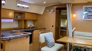 Dining table in the saloon  on  Sailing Yacht Curlew Escape, available for private yacht charters on Moreton Bay, Brisbane.