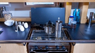Cooking stove and gas range closeup  on  Sailing Yacht Curlew Escape, available for private yacht charters on Moreton Bay, Brisbane.